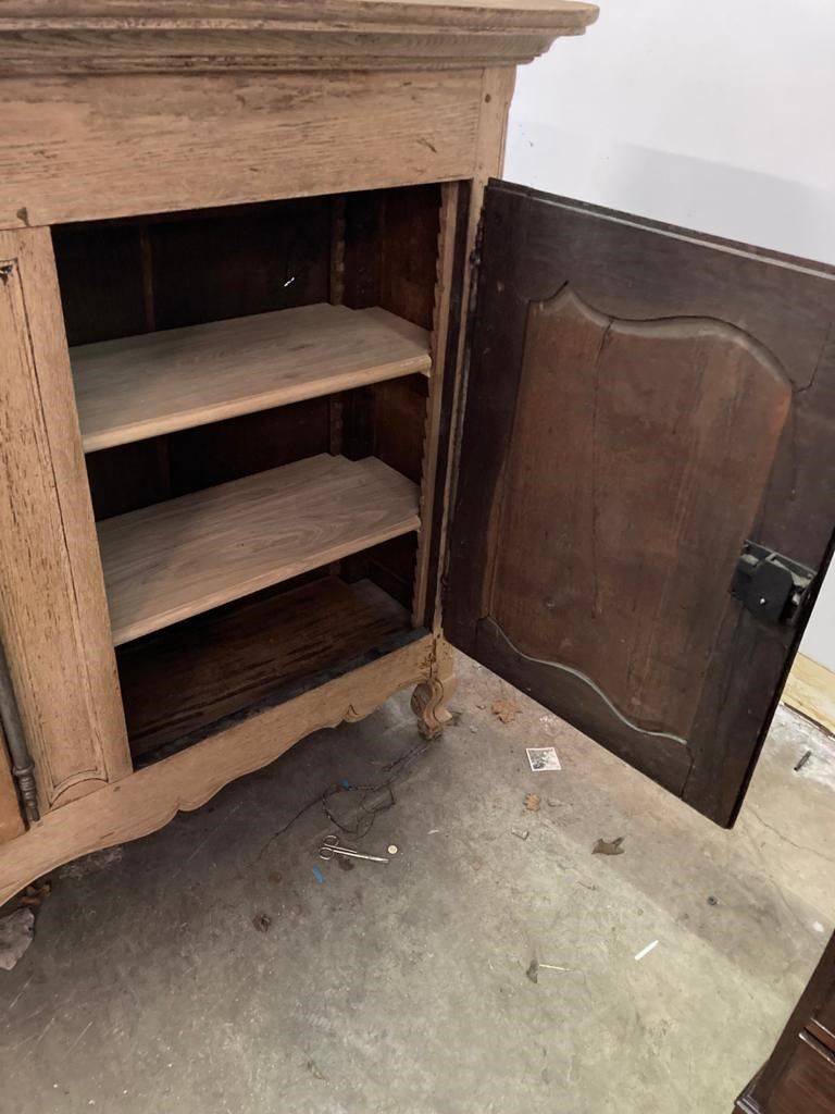 A late 18th century French provincial bleached oak three door buffet, length 244cm, depth 46cm, height 133cm